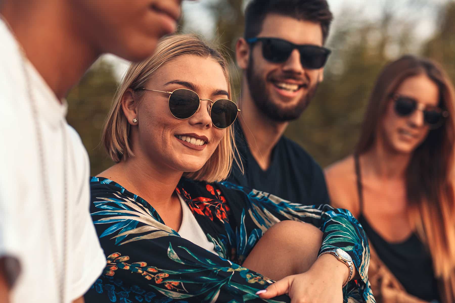 Young woman smiling with her friends